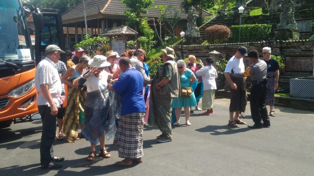 Tourists visit Kehen Temple at Bangli Regency on Sunday.