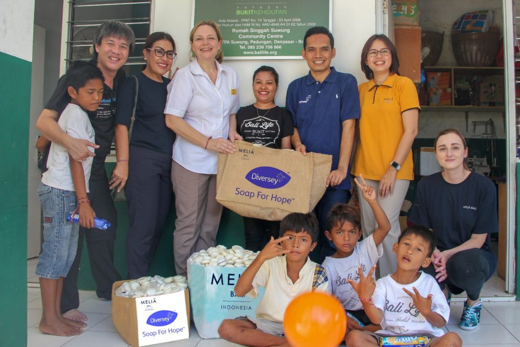 Melia Bali donates soap to people in Suwung.
